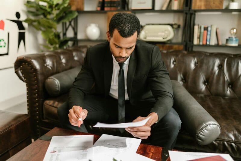 Professional looking through paperwork