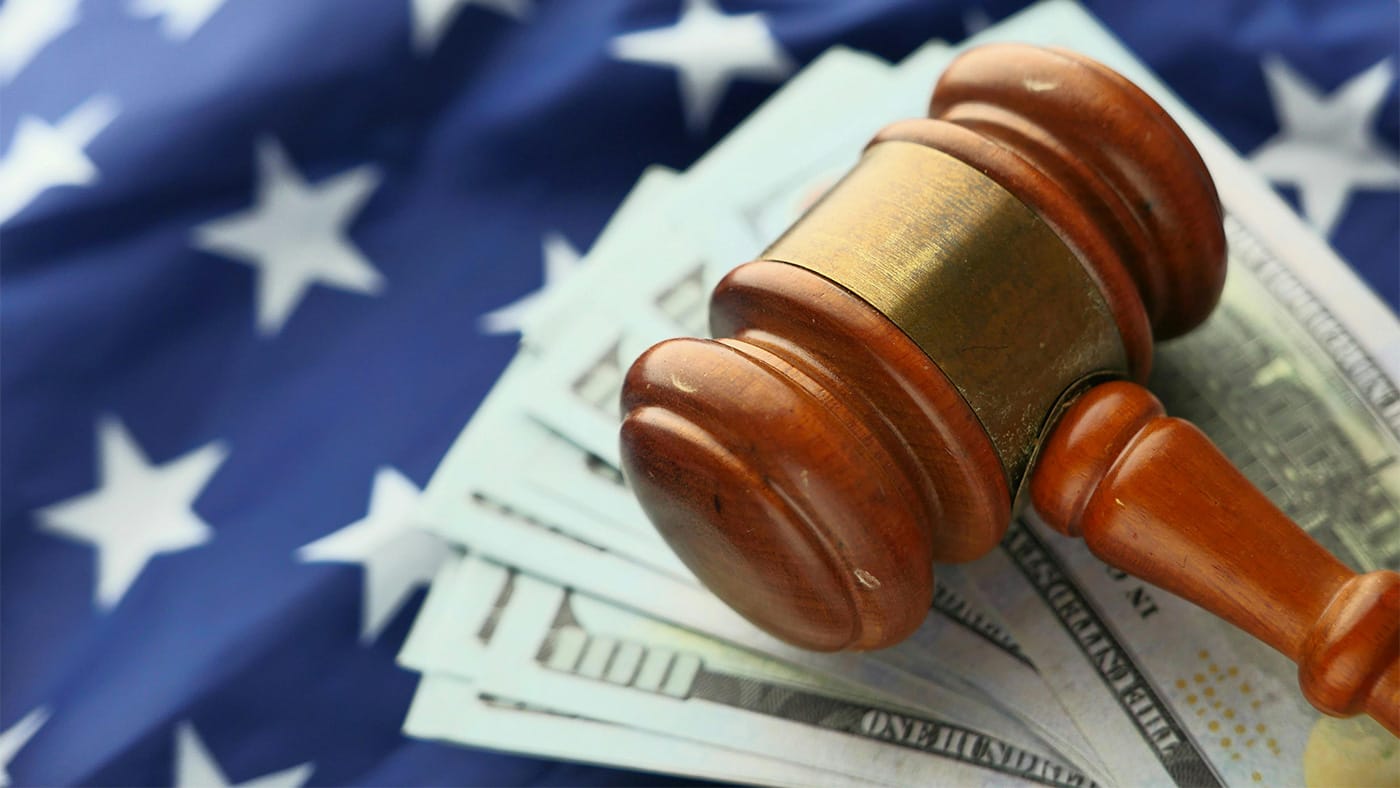 Close-Up photo of Wooden Judge Gavel Over Paper Bills